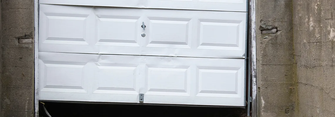 Garage Door Got Hit By A Car Dent Removal in Coquitlam, BC